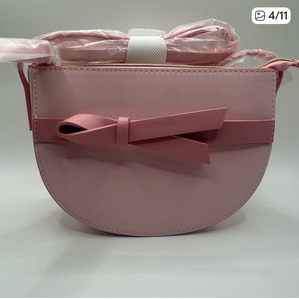 Estée Lauder semi-circle Cross body Bag with bow